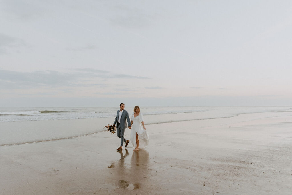 Venue Spotlight: The Beach! | couple walking down oceanside during wedding