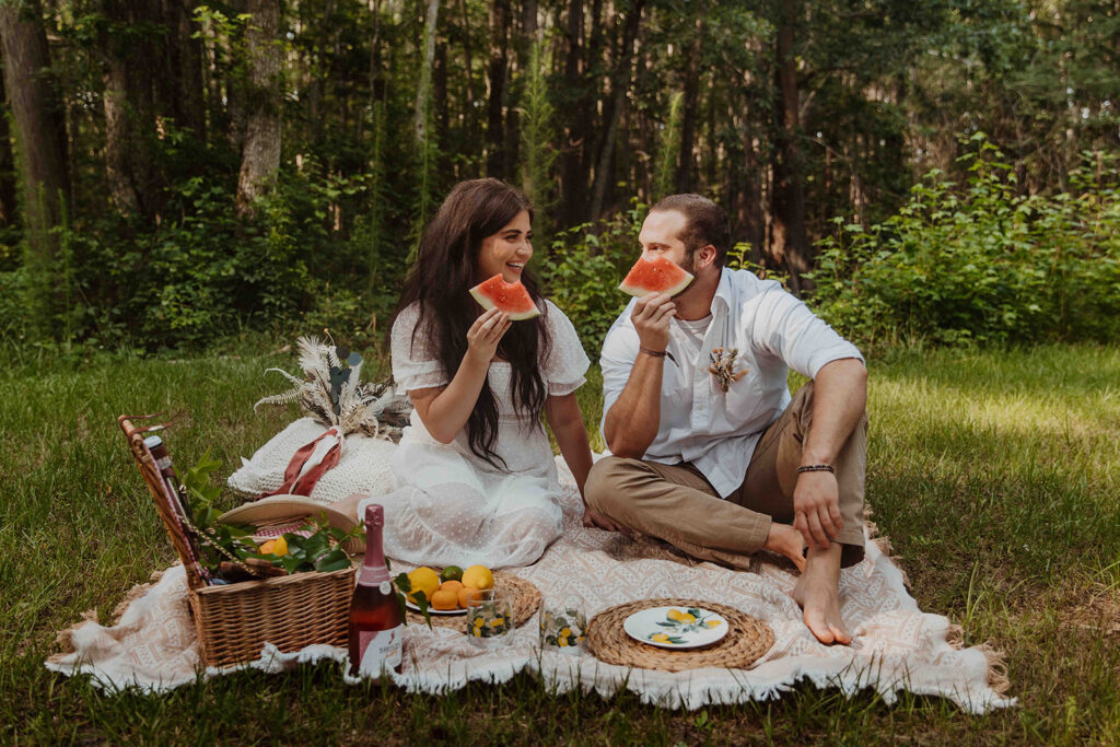 Couple having a picnic for their engagement 