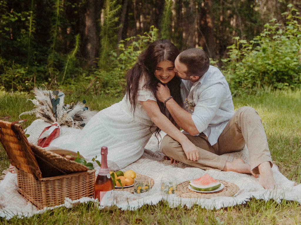 Couple having a picnic for their engagement 