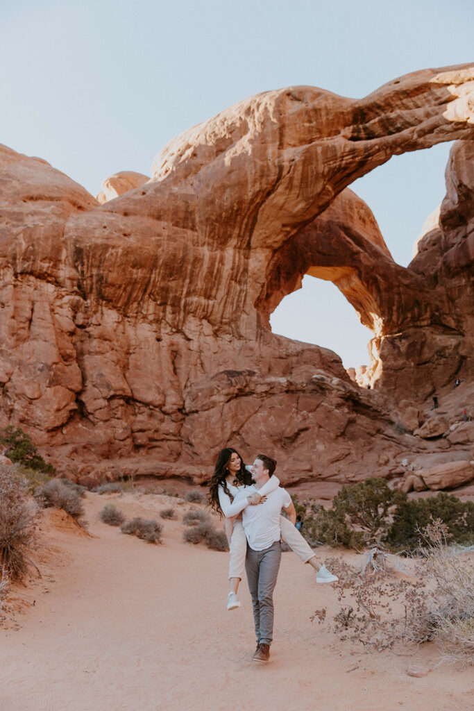 Creative Ideas For Engagement Photos | Couple exploring MOAB for their engagement 