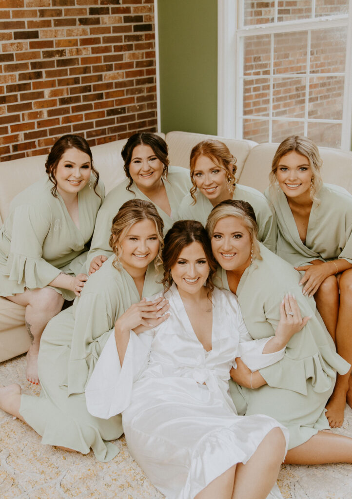 bride with her bridesmaids getting ready