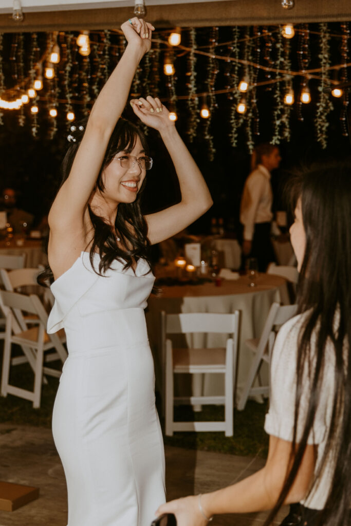 bride dancing during an intimate backyard wedding