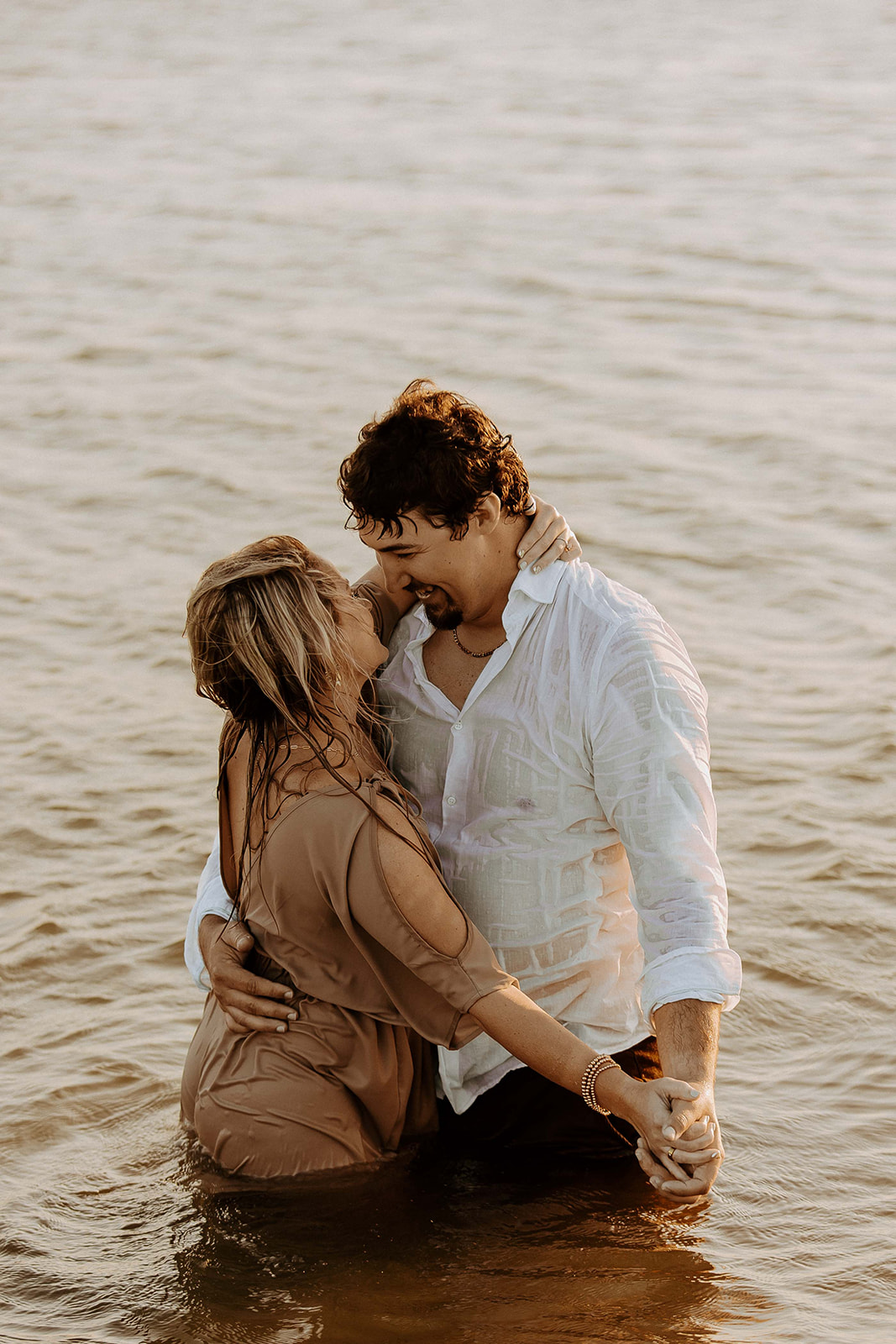 Couple having afun and playful engagement photos session on Tybee island 