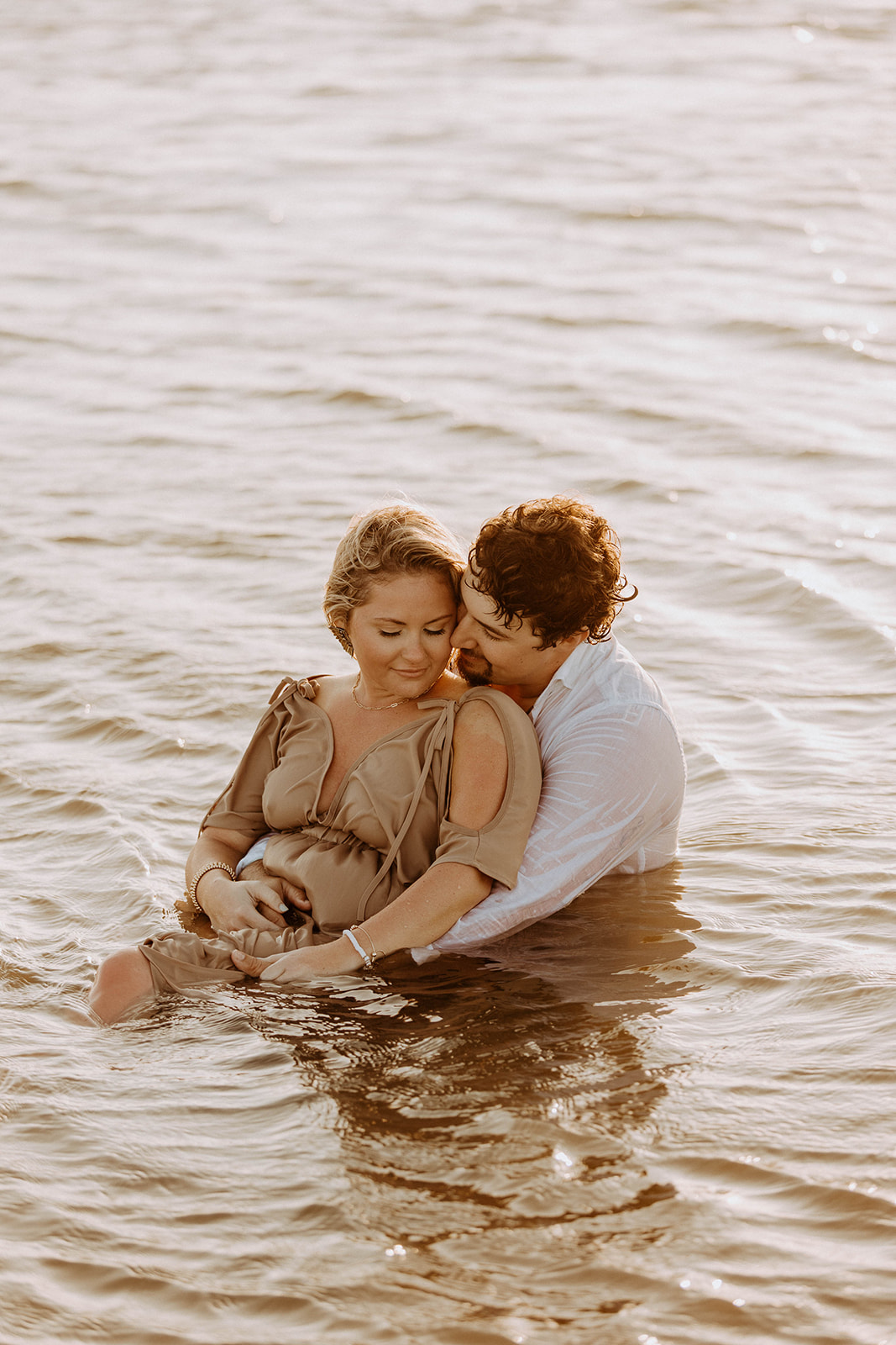 Couple having afun and playful engagement photos session on Tybee island 