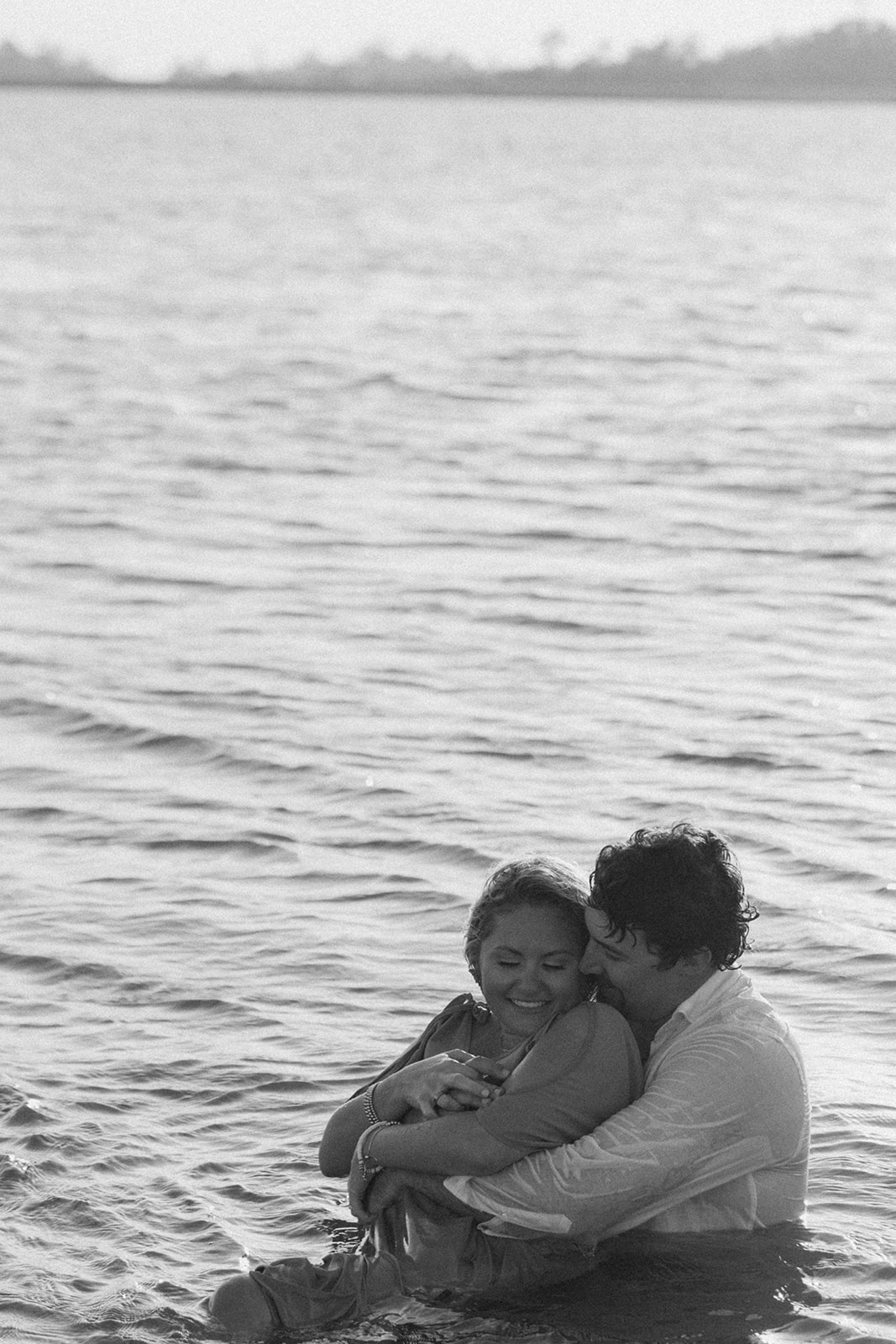 Couple having afun and playful engagement photos session on Tybee island 