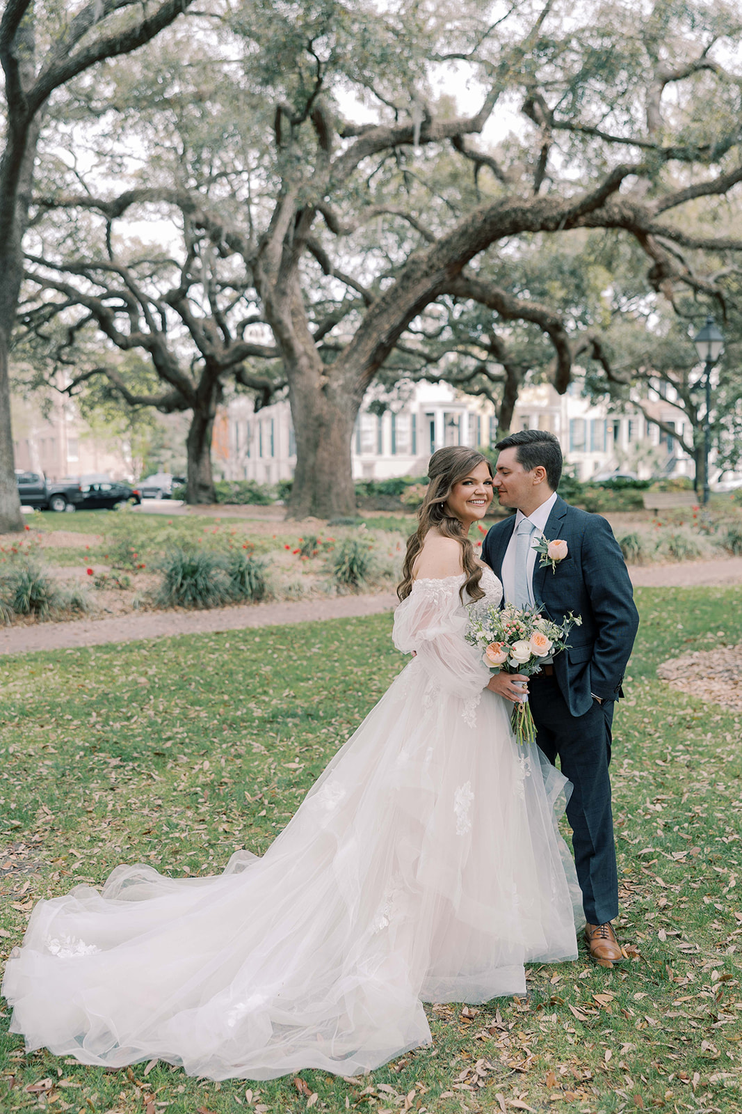 groom kissing the bride on the cheek