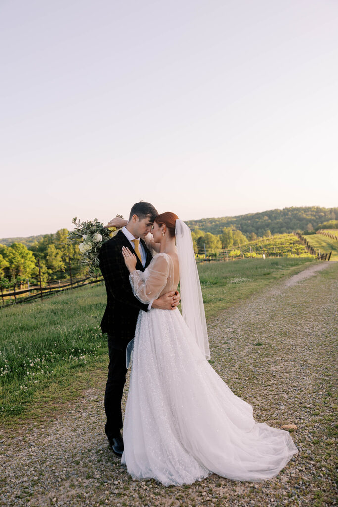 portrait of the bride and groom looking at each other 