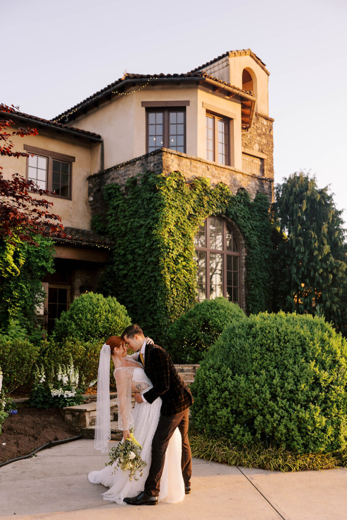cute picture of the bride and groom kissing at their dream wedding 