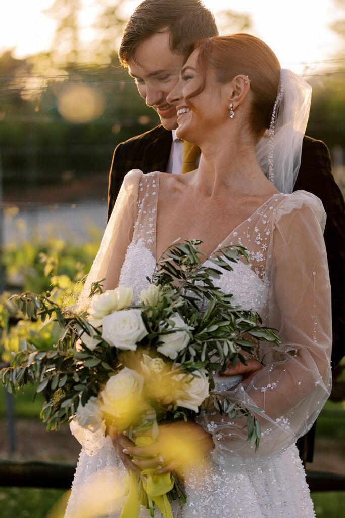 cute couple having the best time at their dream winery wedding