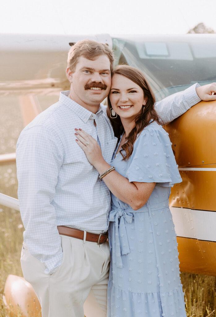 couple smiling at the camera during their anniversary photoshoot