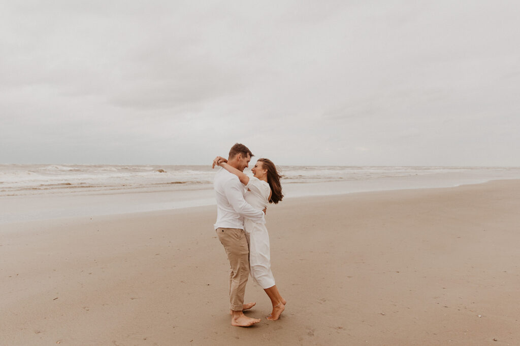 couple kissing during their session at tybee island