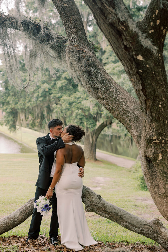 portrait of the newlyweds kissing 