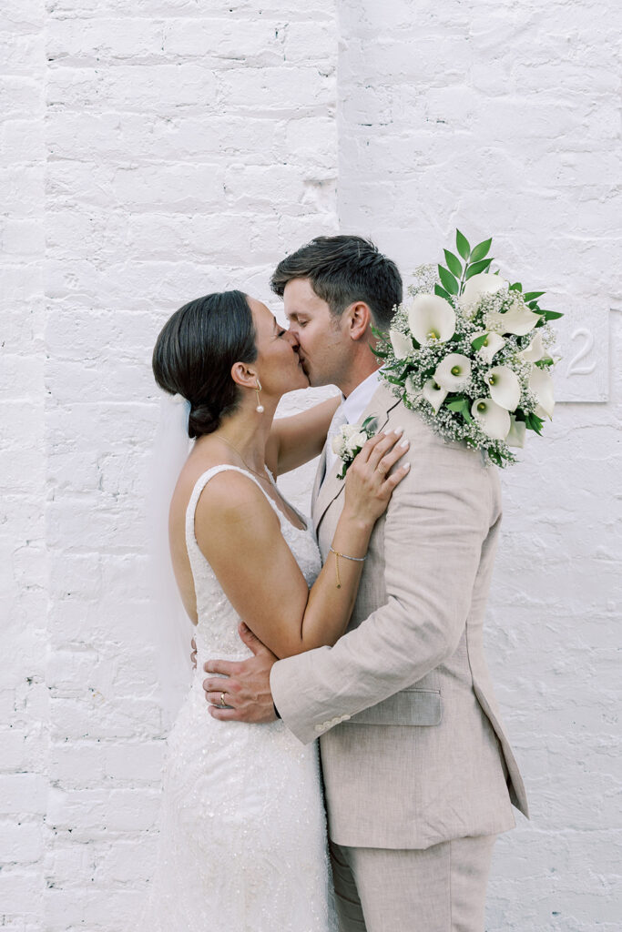 picture of the bride and groom kissing during their bridal portrait 
