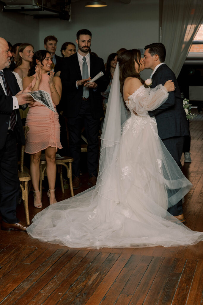 couple kissing after their ceremony 
