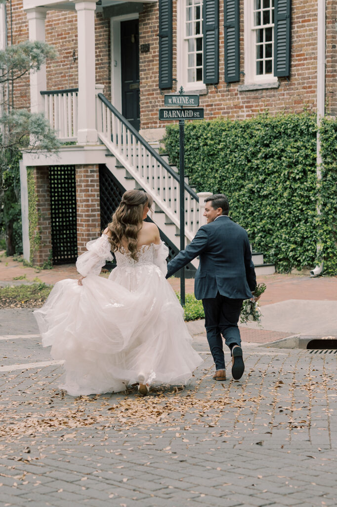 couple holding hands during their bridal portraits 