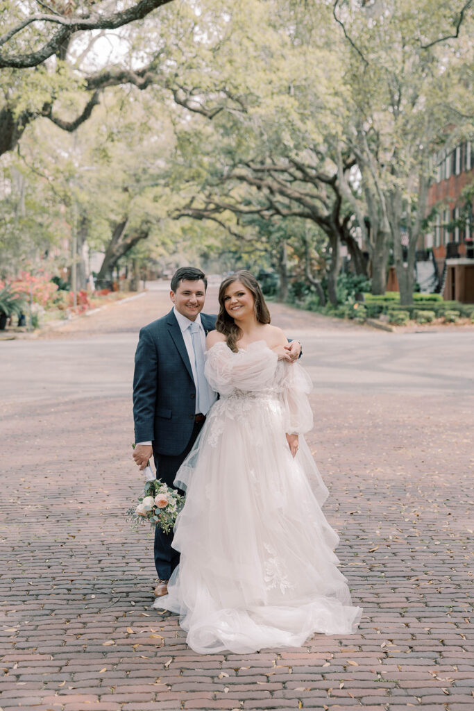 couple posing for the camera during their bridal session after their ceremony 