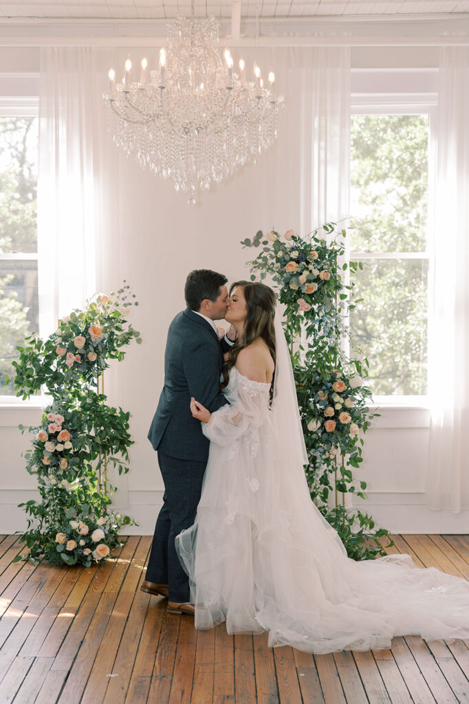 picture of the bride and groom kissing during their bridal portrait 