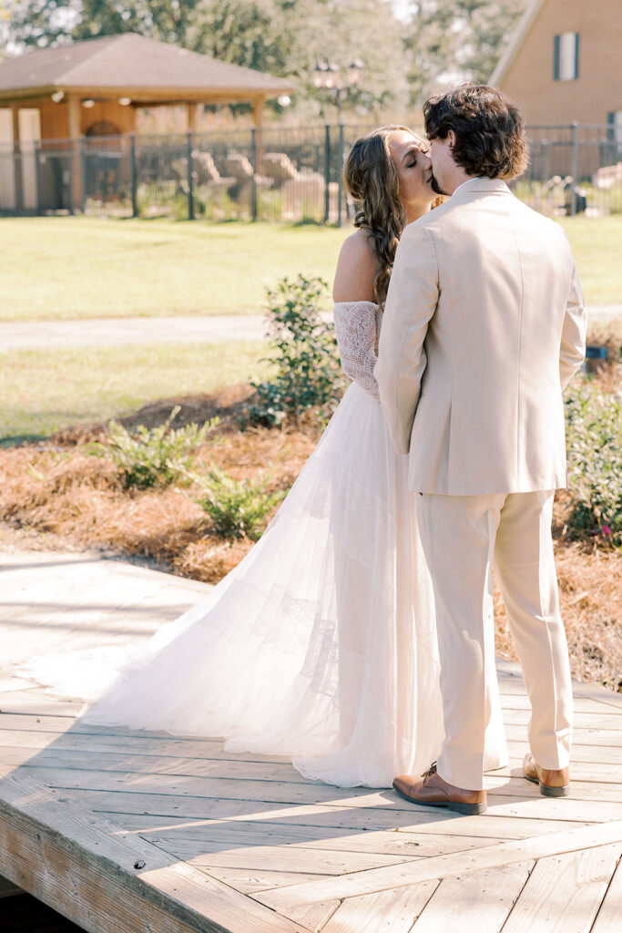 bride and groom, kissing during their first look