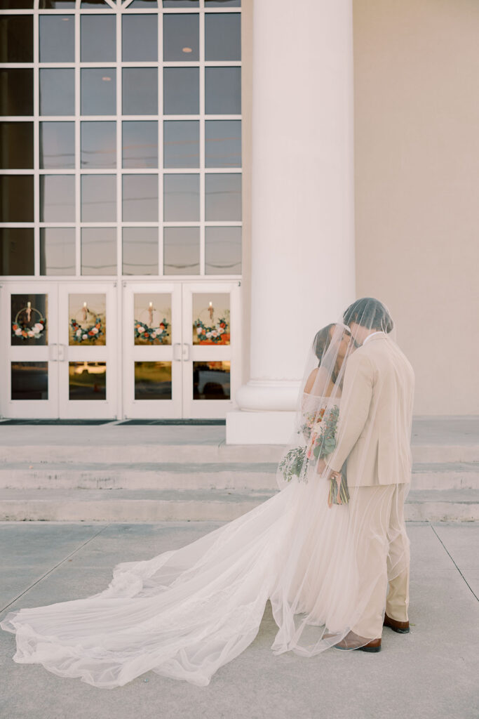 Picture of the newly married couple kissing