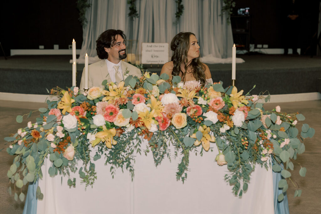 Newlywed during their reception family speeches