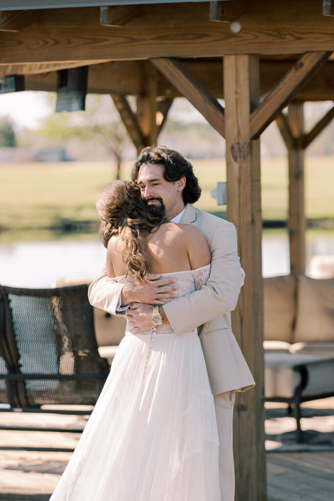Cute picture of the bride and groom, hugging during their first look