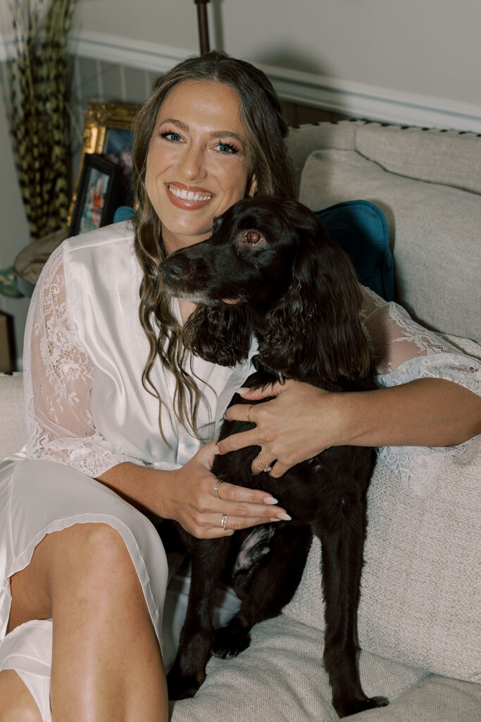 Cute picture of the bride and her dog before getting ready for the ceremony