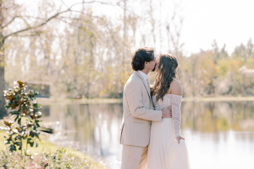Picture of the newly married couple kissing during their bridal portraits