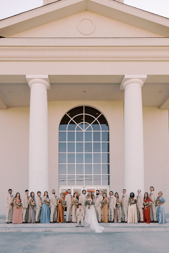 Picture of the bride and groom with their bridal party