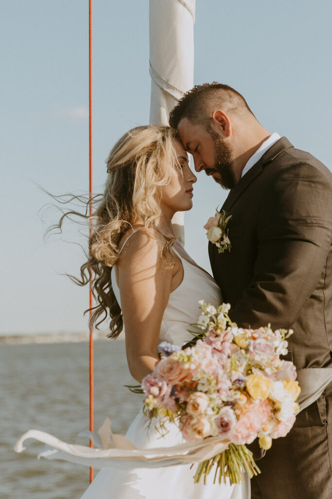 cute picture of the bride and groom smiling at each other during their photoshoot