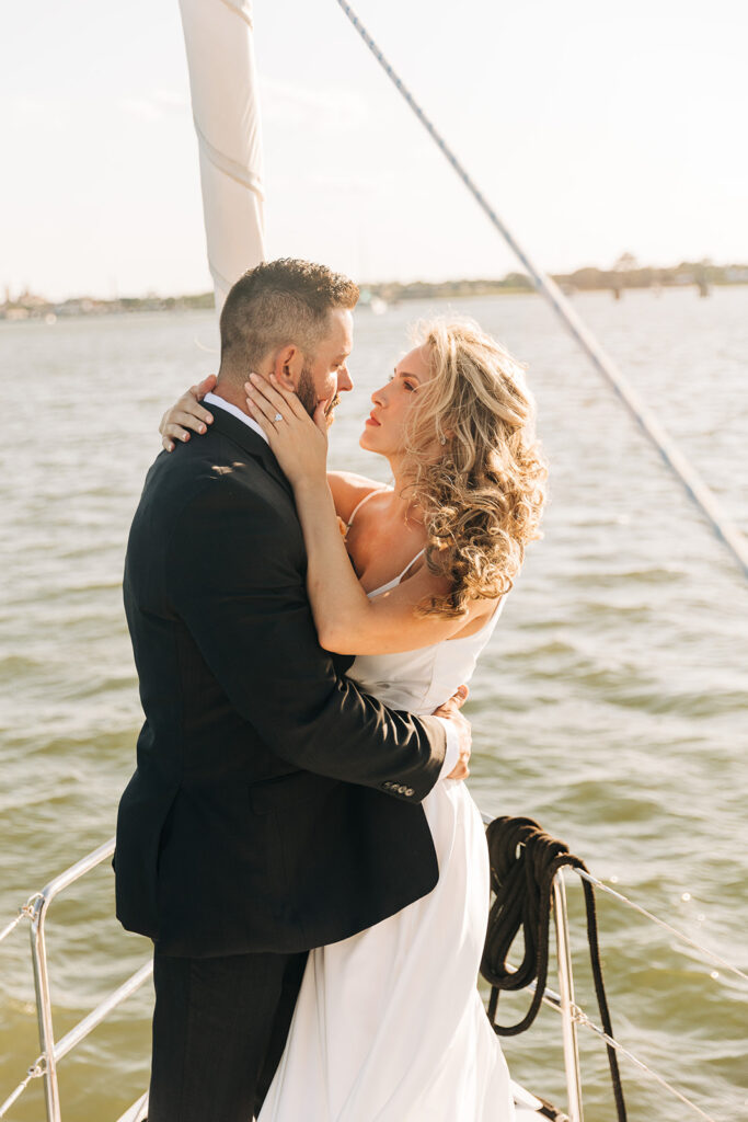portrait of the bride and groom smiling at each other 