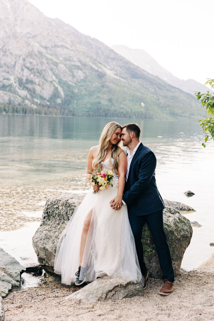 bride and groom smiling at each other during their photoshoot