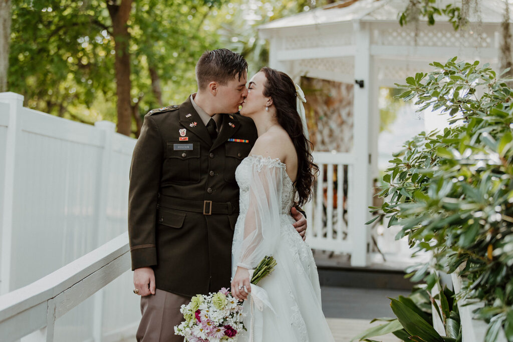 portrait of the newlyweds kissing 