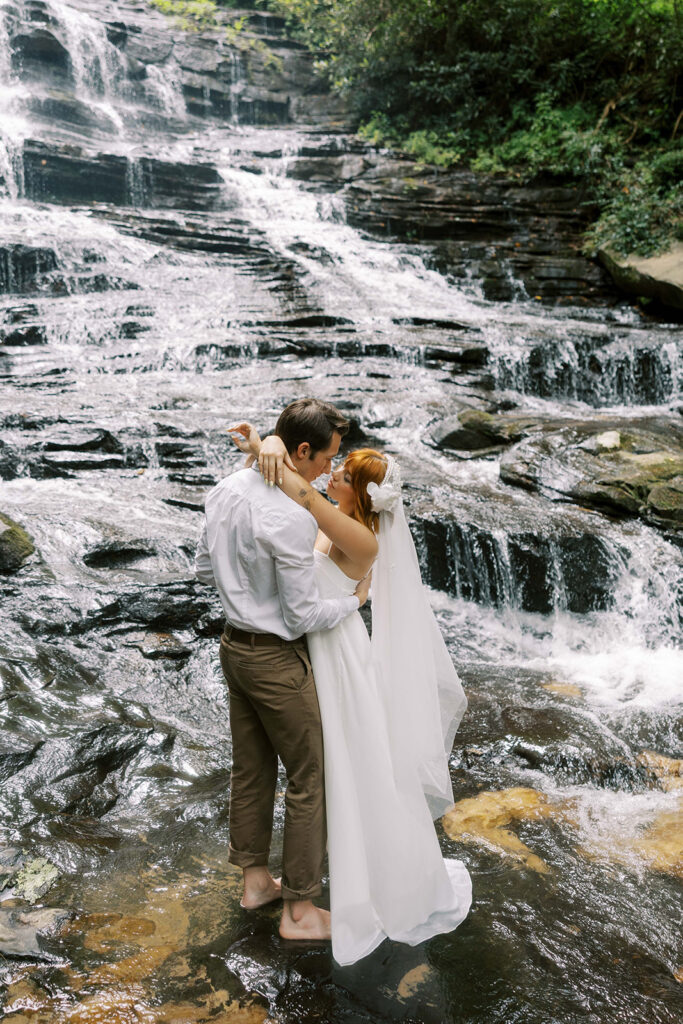 cute picture of the bride and groom kissing during their photoshoot