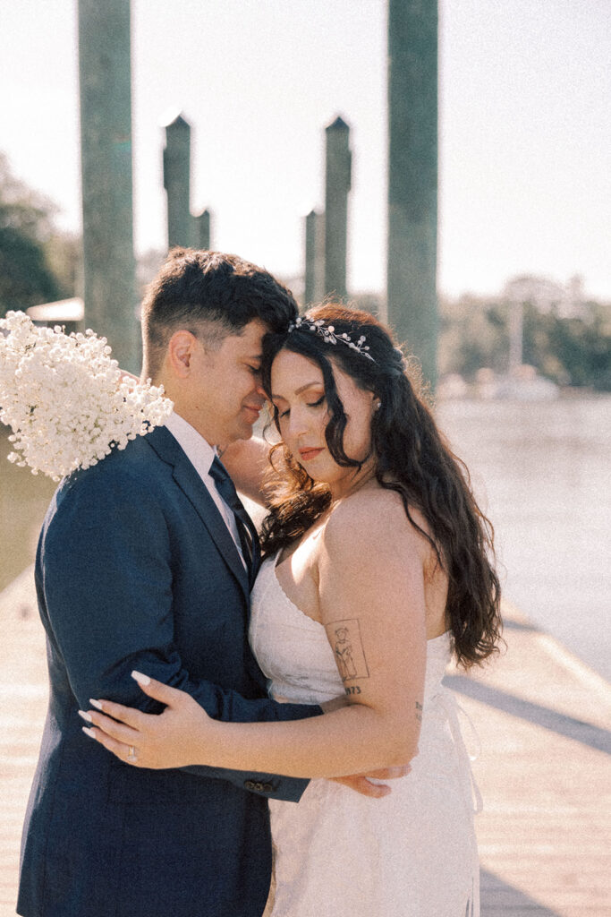 groom kissing the bride on the cheek