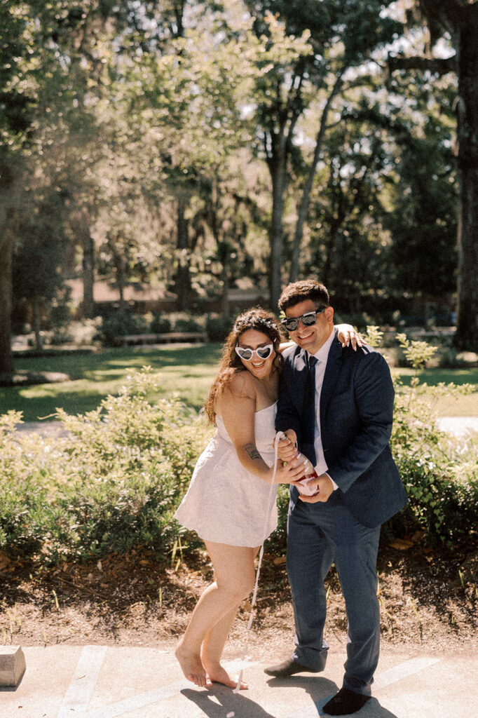 couple celebrating their elopement with champagne 