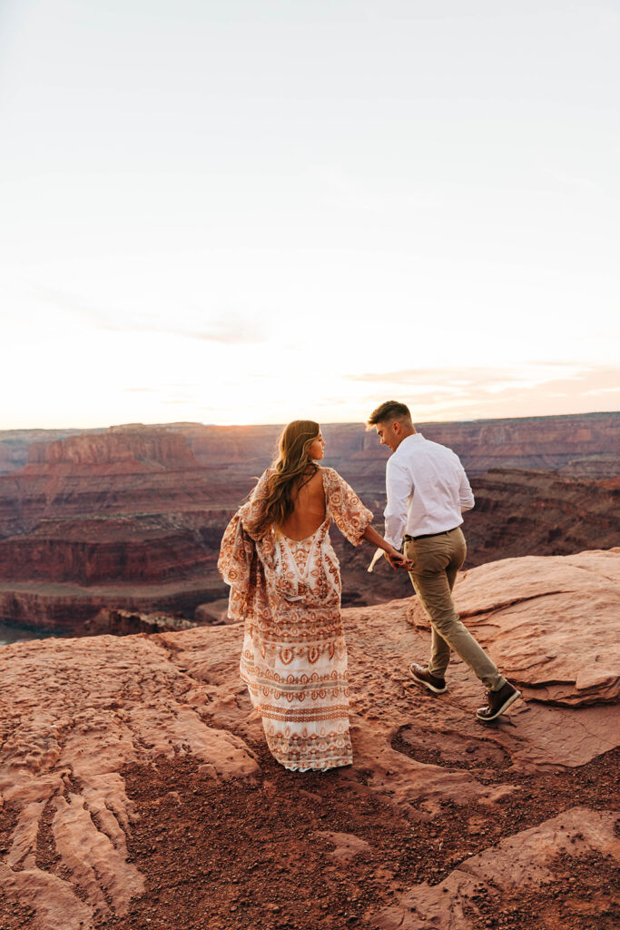 cute couple running during their photoshoot