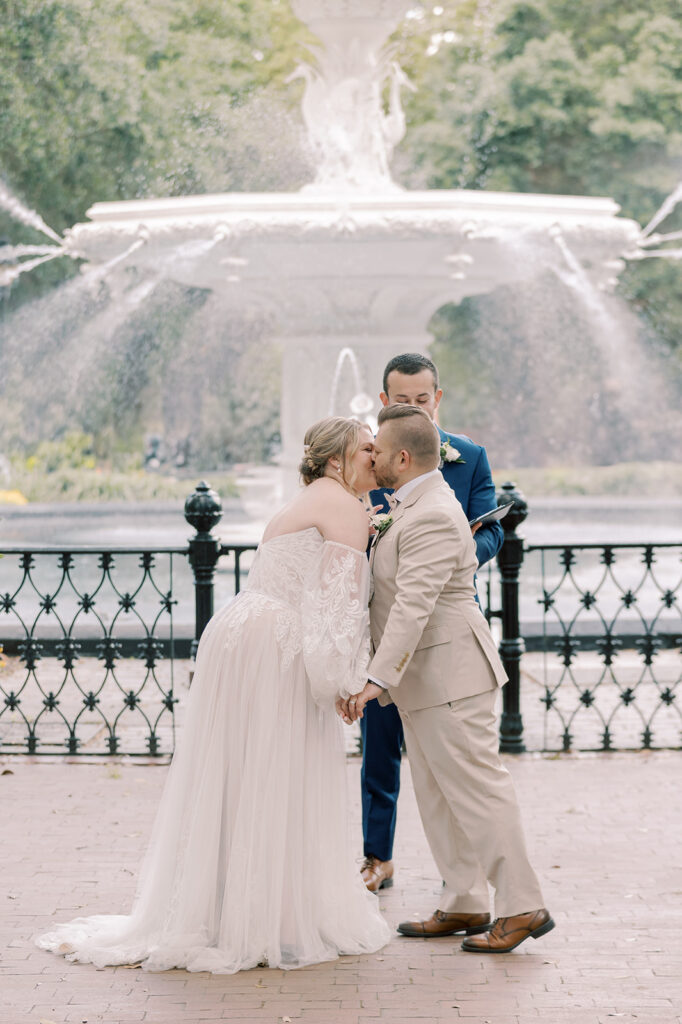 Bride and groom, kissing after their ceremony