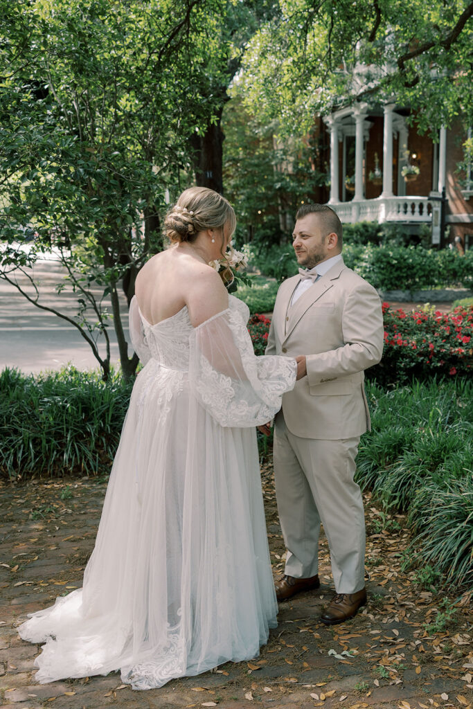 cute couple holding hands during their first look