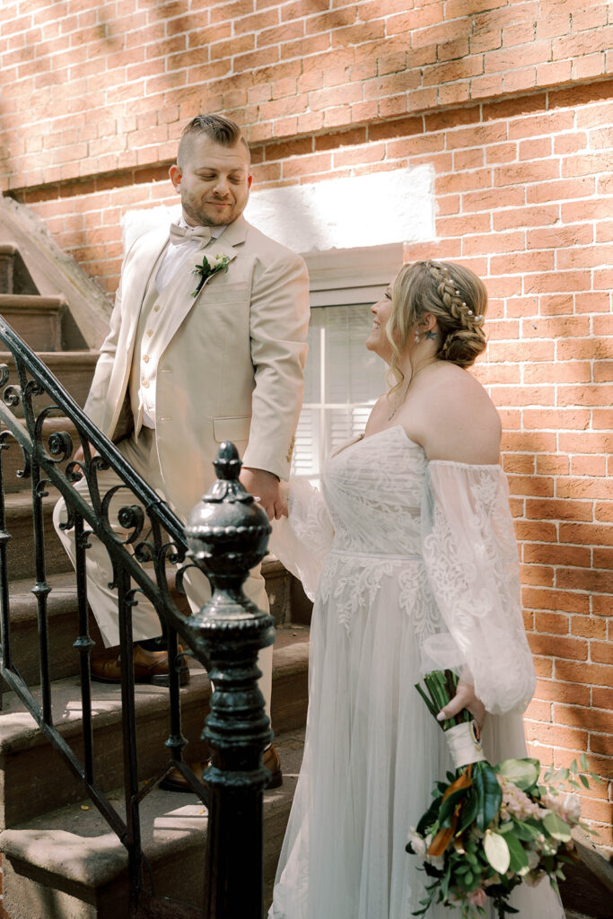 picture of the bride and groom smiling at each other during their photoshoot