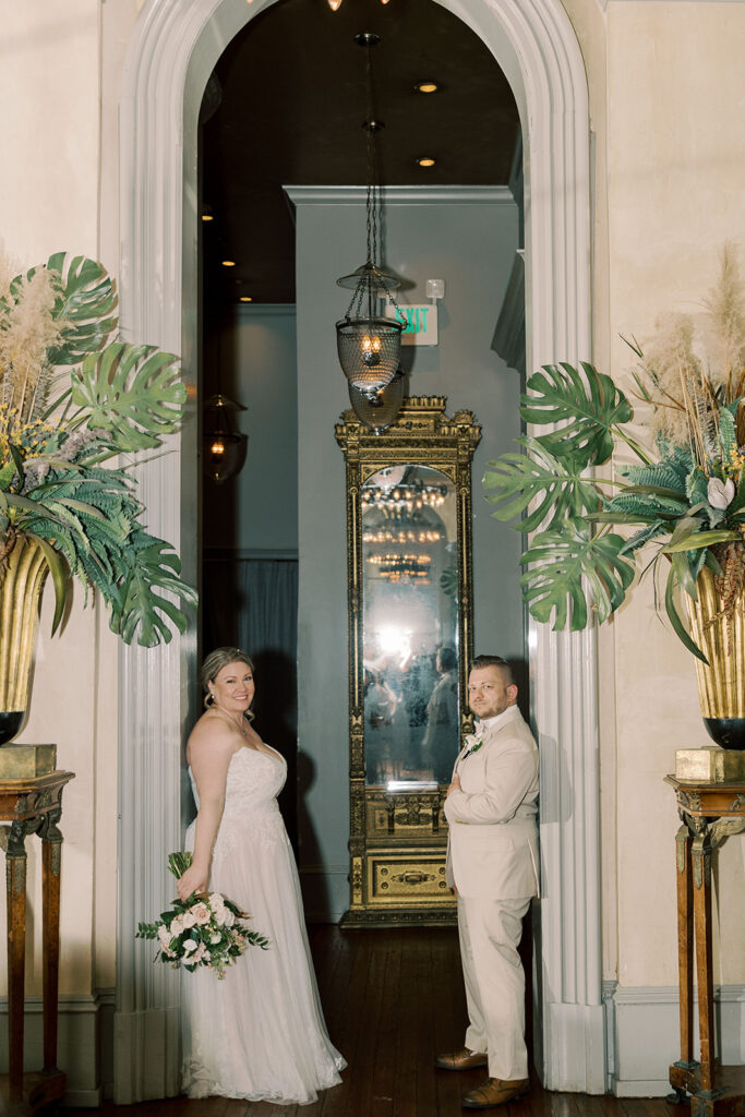 Couple posing for the camera during their bridal portraits at the reception party