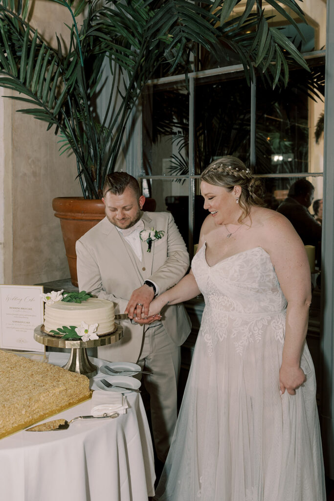 Picture of the newly married couple cutting their wedding cake
