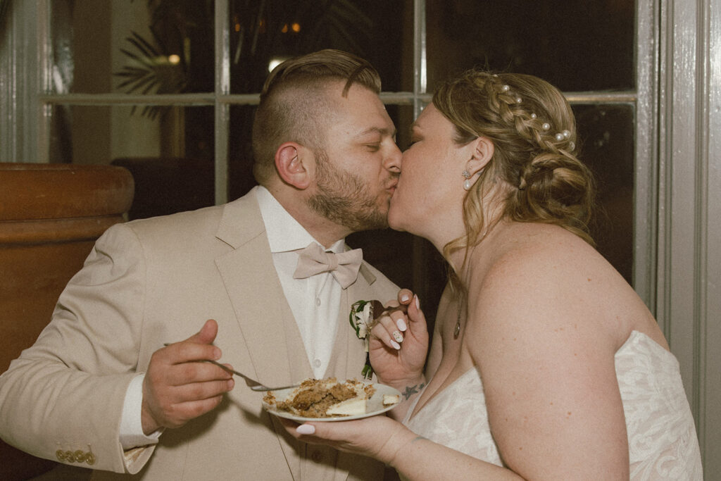 Portrait of the newly married couple kissing