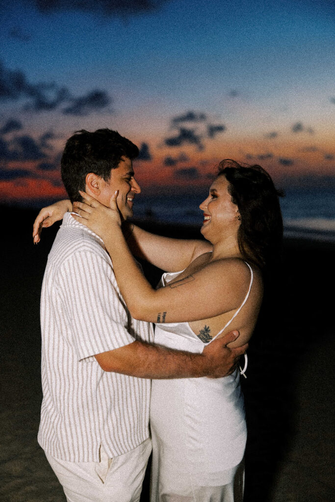 portrait of the couple laughing with each other during their photoshoot