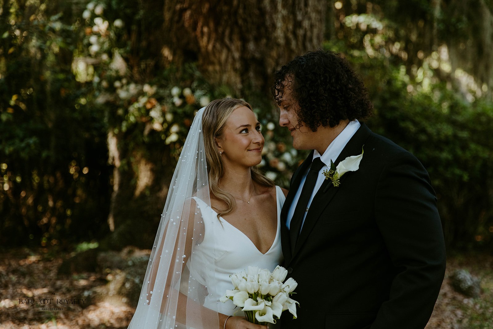 cute picture of the bride and groom smiling at each other