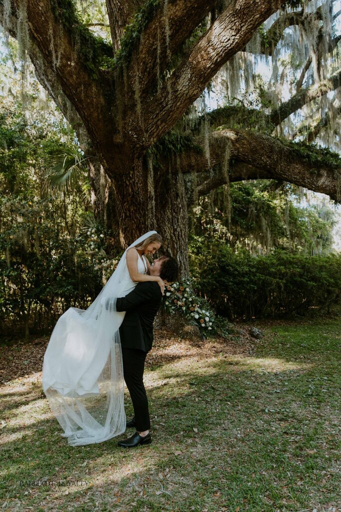 portrait of the newlyweds kissing
