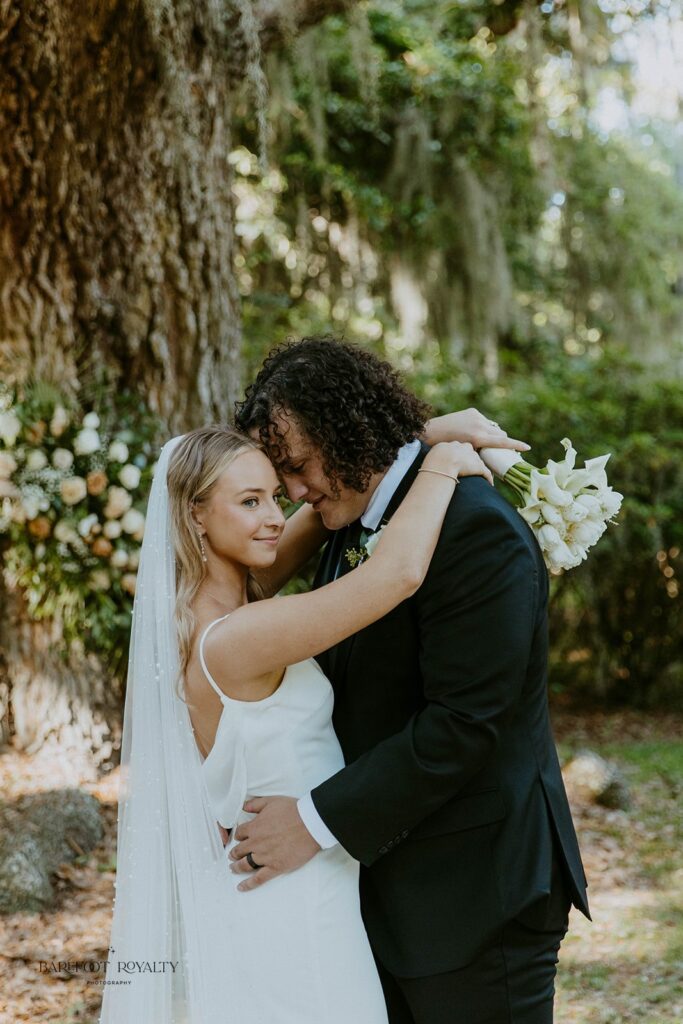 groom kissing the bride on the cheek