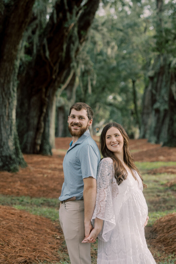 couple smiling at the camera during their photoshoot