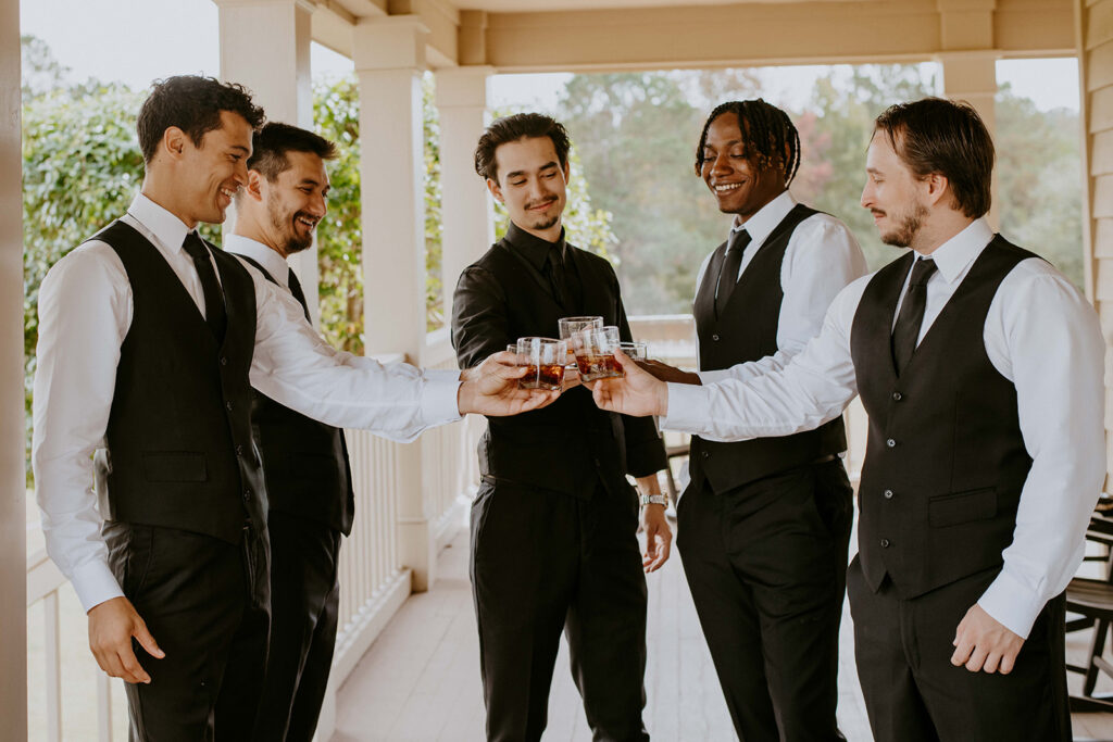 groomsmen having the best time before the ceremony