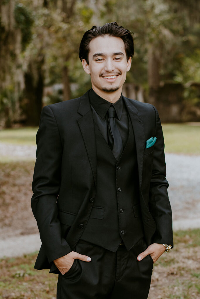 husband to be posing for the camera during his photoshoot