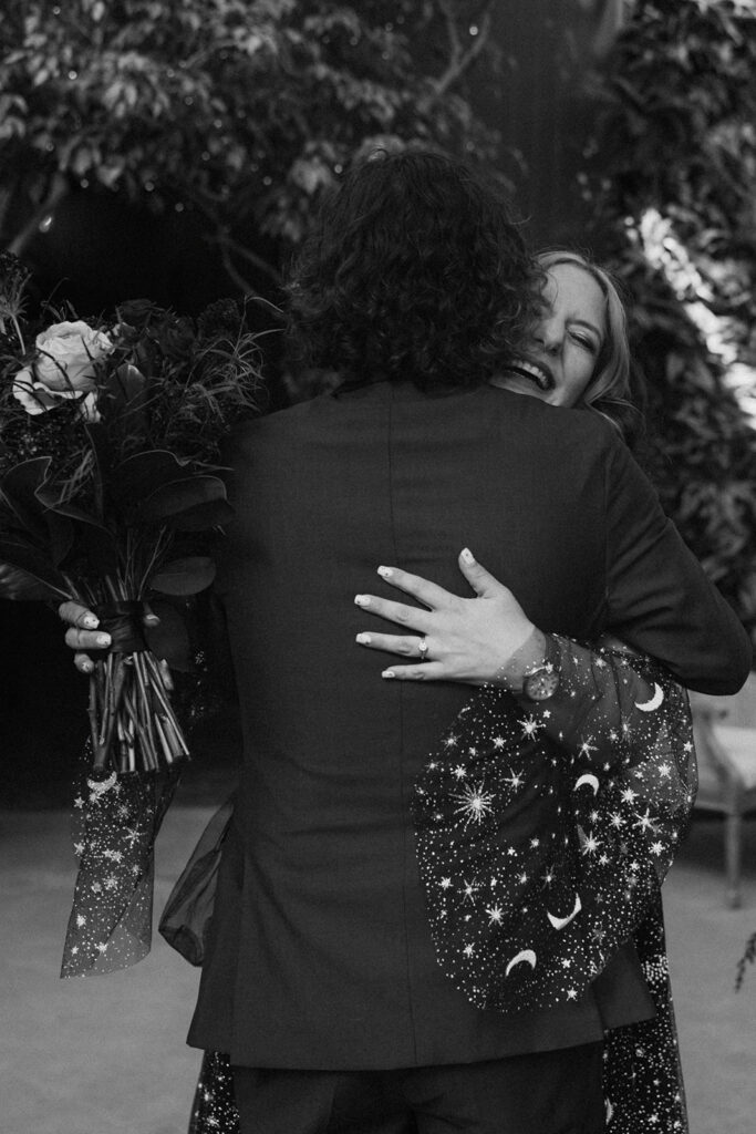 Couple hugging after their first look